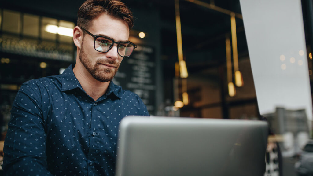 man looking at laptop